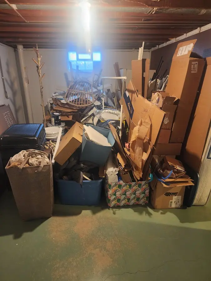 Roll-off dumpster container at job site for 2 Yard Dumpster Rental in Westmoreland