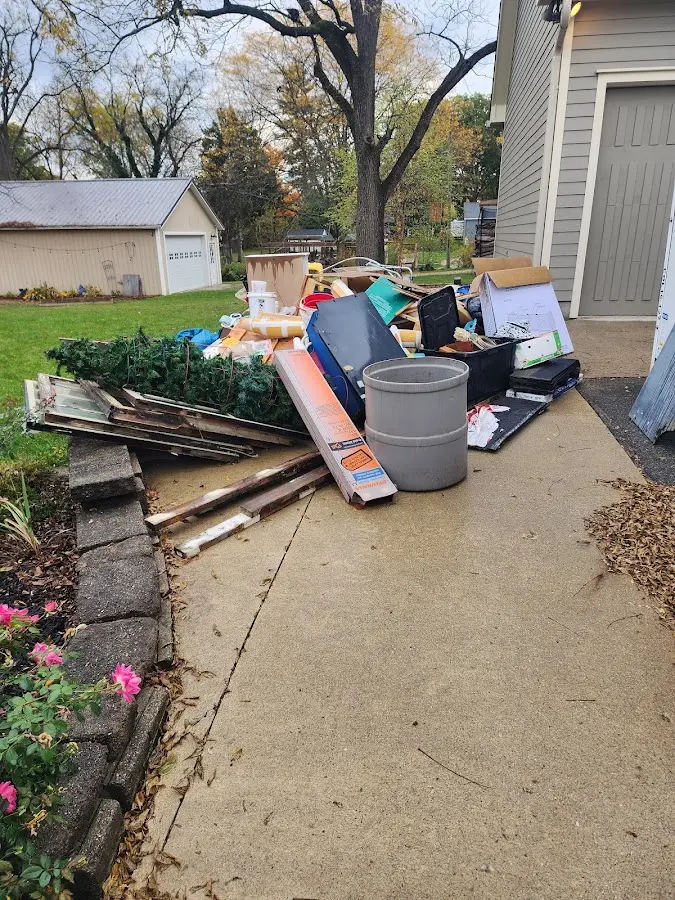 Dumpster being loaded with debris for Commercial Dumpster Rental in Westmoreland